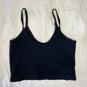 Out from under black tank top